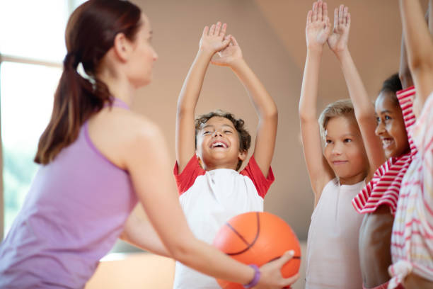 istock Children cheering up before playing basketball together 1174480630