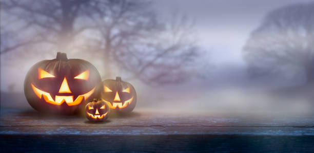 istock A ghostly dusk in the countryside with spooky Jack O' Lanterns 1174481384
