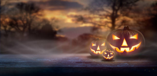 istock Mist rolling in over the spooky glow of Jack O' Lanterns 1174481419