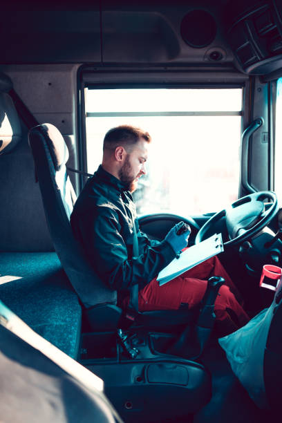 istock Truck Driver Checking Delivery Information 1174481433