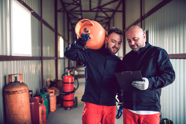 istock Colleagues Checking Information About Gas Cylinder 1174482039