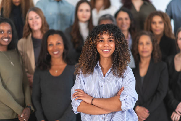 istock Woman posing with multi-ethnic group of adults 1174486807