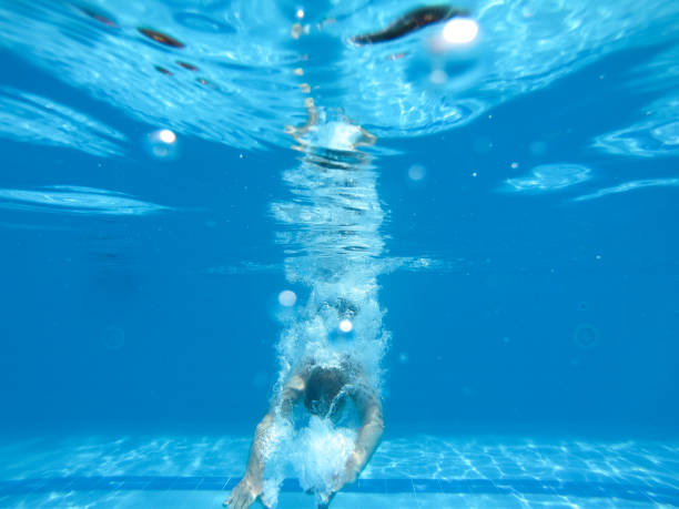 istock Woman jumped into a swimming pool 1174490116