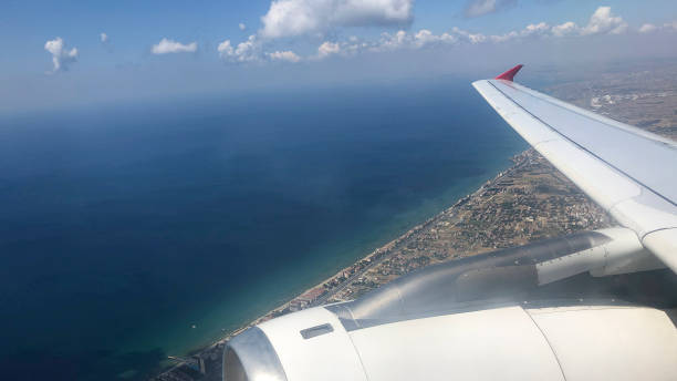 istock Airplane wing flying above the clouds 1174490129