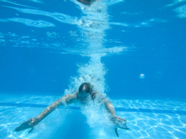 istock Woman jumped into a swimming pool 1174490185