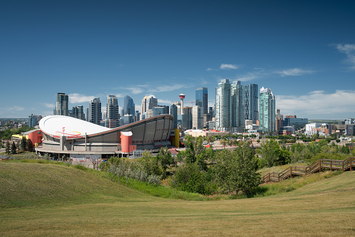 Calgary, Canada - August 5, 2019: Panoramic image of the skyline of Calgary with the Saddledom in the foreground on August 5, 2019 in Alberta, Canada