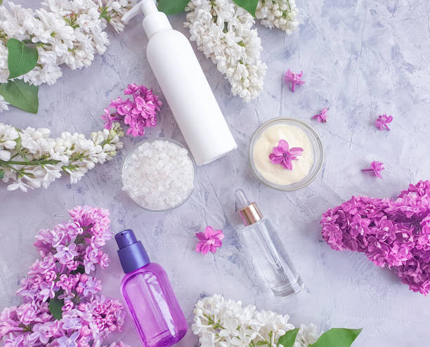 istock cream cosmetic flower lilac on concrete background 1174494951