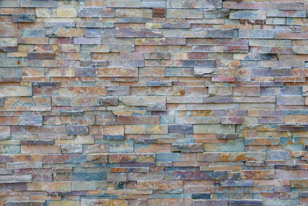 istock Colorful textured stone wall for background 1174494987