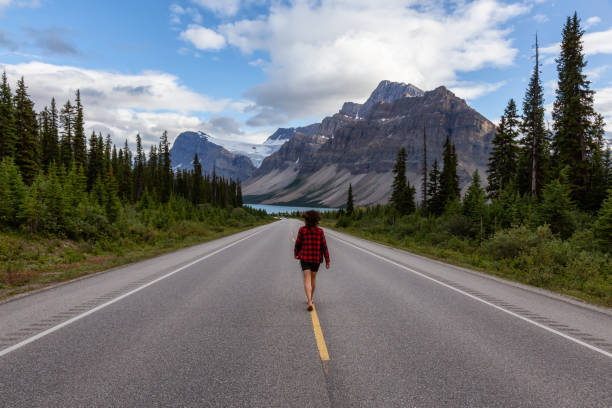 istock Female Traveler on the Road 1174495964