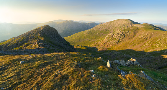 Sunset over Ennerdale from Scoat Fell views of Steeple and Pillar In the English Lake District, UK.