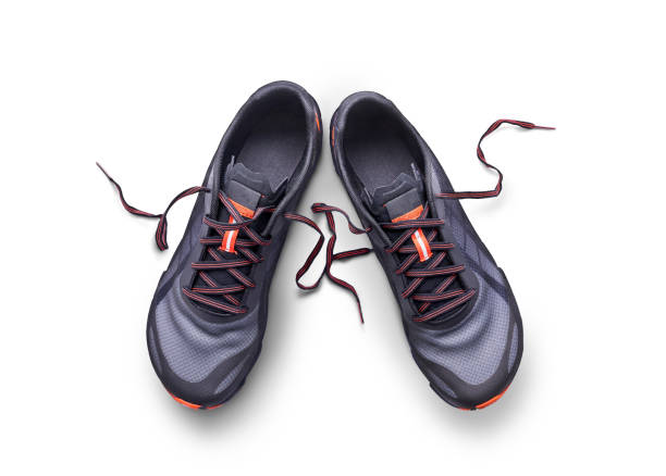 istock Gray and orange trainers isolated on a white background. 1174496989