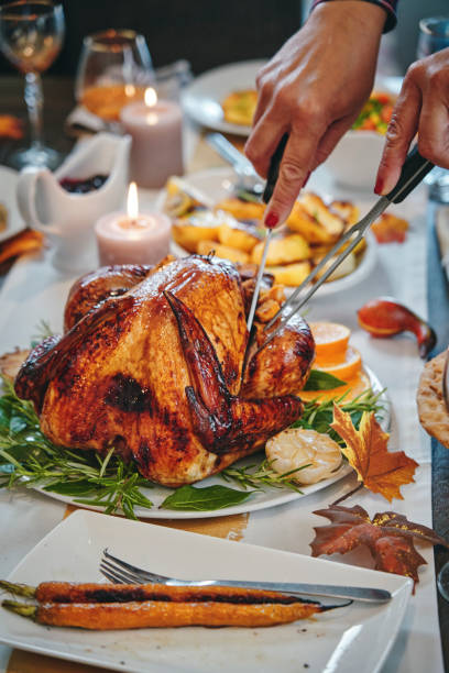 istock Family Having Traditional Holiday Stuffed Turkey Dinner 1174497039
