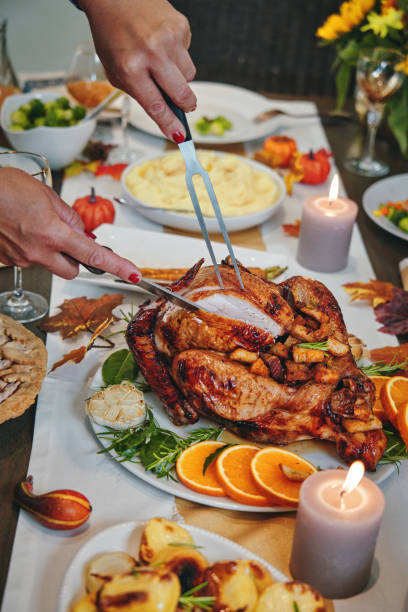 istock Family Having Traditional Holiday Stuffed Turkey Dinner 1174497042