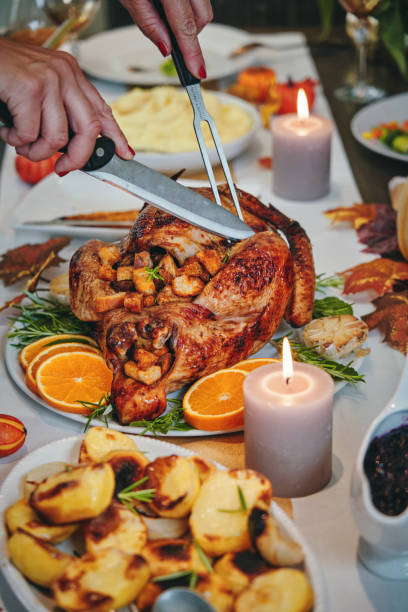 istock Family Having Traditional Holiday Stuffed Turkey Dinner 1174497046
