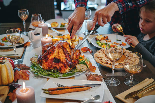 istock Family Having Traditional Holiday Stuffed Turkey Dinner 1174497047