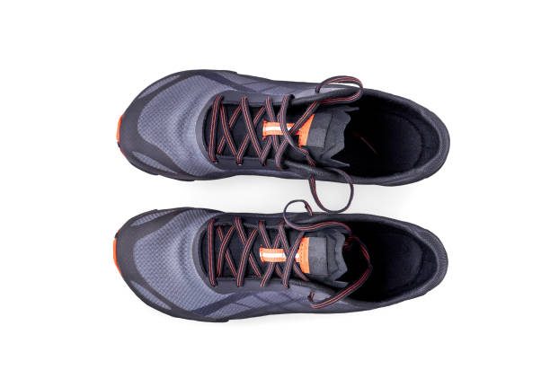 istock Gray and orange trainers isolated on a white background. 1174497216