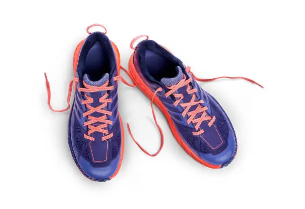 A top view of purple and orange Trainers Isolated on a white background.