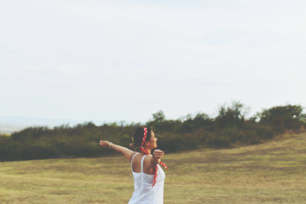 istock Girl in the field 1174498230