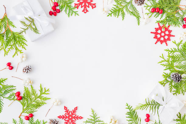 istock Flat lay christmas frame with evergreen tree branch and gift box on a white background 1174498274