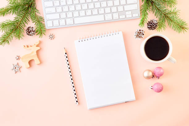 istock Mockup white notebook with spruce branche and keyboard, christmas decorations on a color background 1174498335