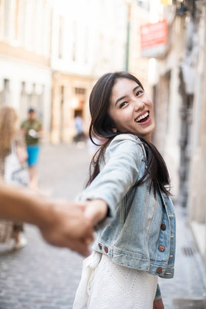 istock Young woman leading her boyfriend 1174498623