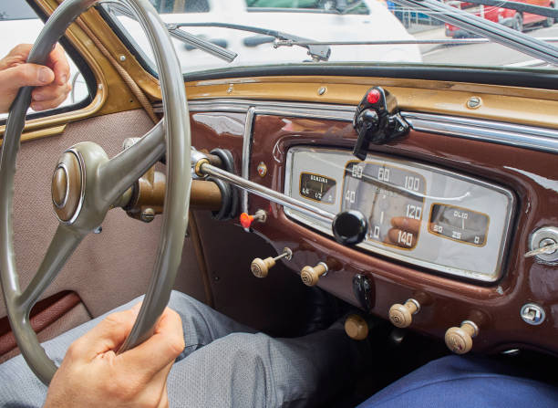 istock A male hands driving a classic car. 1174499480