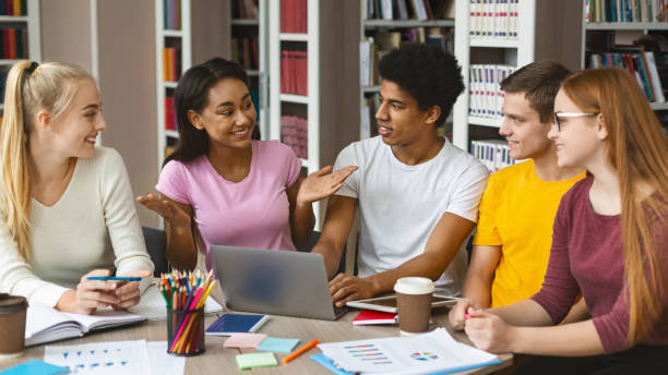 istock Smart afro girl sharing her creative ideas with friends 1174499507
