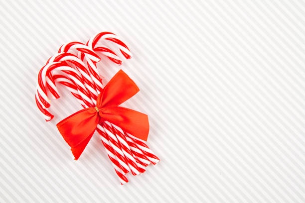 istock Christmas sugar canes. Invitation, christmas celebration, festive greeting card 1174499583
