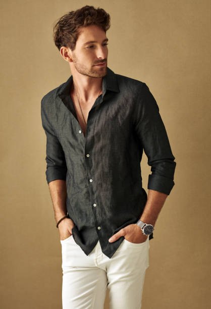 istock Handsome young man in daily casual outfit posing over studio background 1174499657