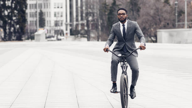 istock Businessman riding on bicycle to office, free space 1174500411