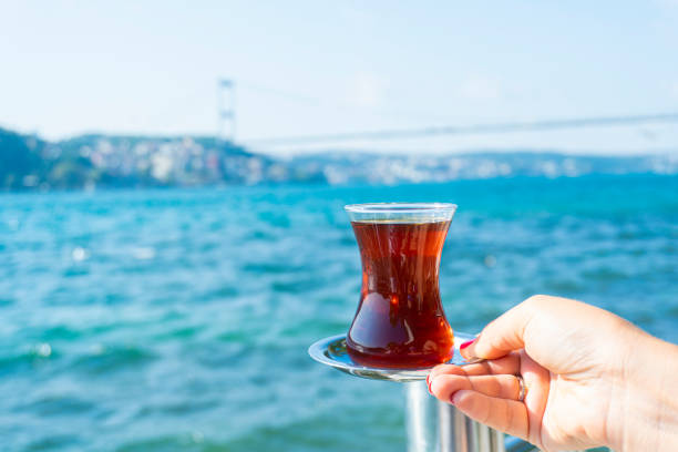 istock A hand holding a tea at istanbul bosphorus view 1174500562