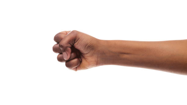 Clenched fist of african american female isolated on white background Power concept. Black woman's hand with clenched fist, fight gesture, ready to punch, isolated on white background. fist stock pictures, royalty-free photos & images