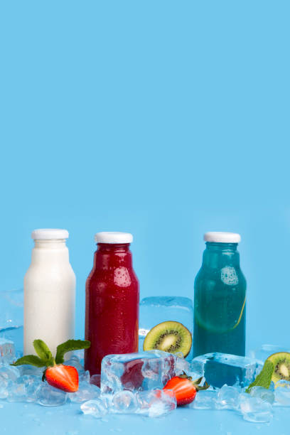 istock Healthy detox drinks of fresh ingredients on blue background 1174501840
