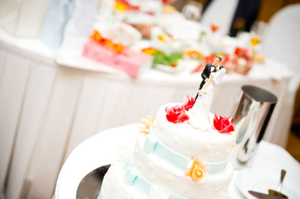 istock wedding cake with bride and groom figurines upstairs 1174503583