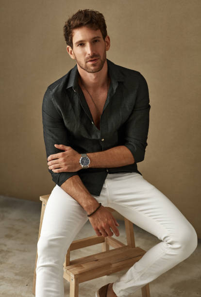 istock Handsome young man in daily casual outfit posing over studio background 1174505716