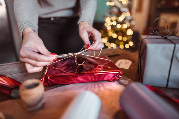 istock woman making the package for the christmas gift 1174505824
