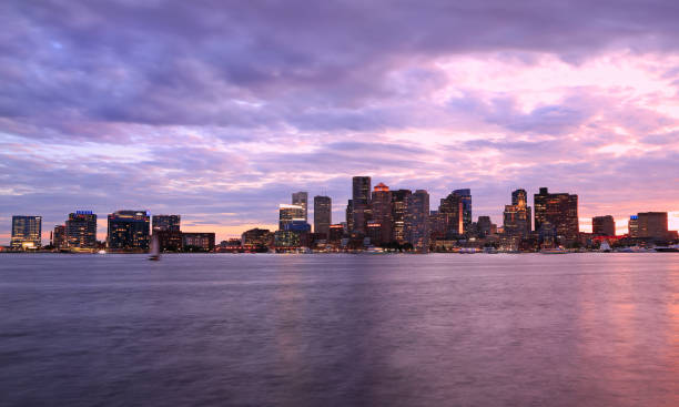 istock Boston skyline at dusk with skyscrapers reflection on the ocean 1174508431