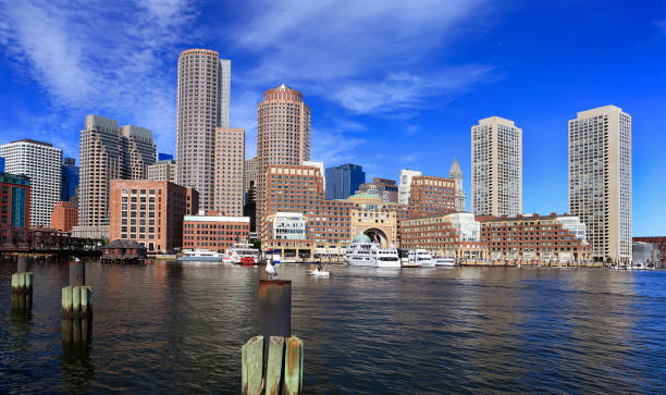 istock Colorful Boston skyline early morning with skyscraper reflections into the ocean 1174508444