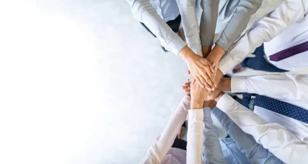 Photo of Stack of hands. Unity and teamwork concept.