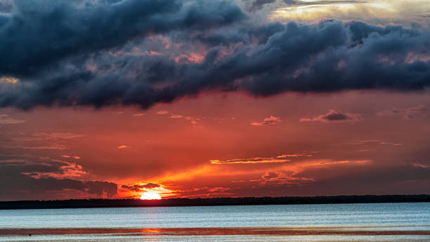 Red Dawn Sunrise photo with thunderstorm clouds. new britain island stock pictures, royalty-free photos & images