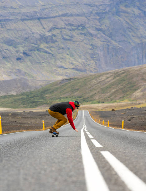 istock One man skateboarding on road in Iceland 1174514626