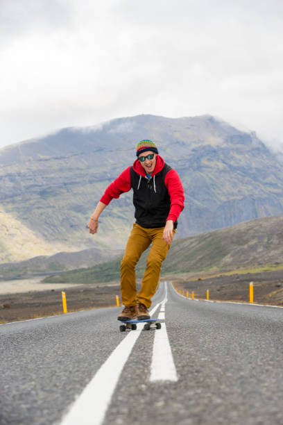 istock One man skateboarding on road in Iceland 1174514633