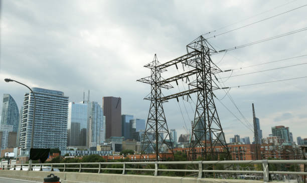 Toronto, Canada - August 20, 2019: Transmission towers line the historic St. Lawrence neighbourhood downtown. Background shows the modern buildings of the Financial District. Summer afternoon with dramatic skies.