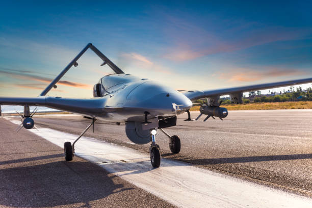 Armed Unmanned Aerial Vehicle on runway Armed Unmanned Aerial Vehicle on runway unmanned aerial vehicle stock pictures, royalty-free photos & images