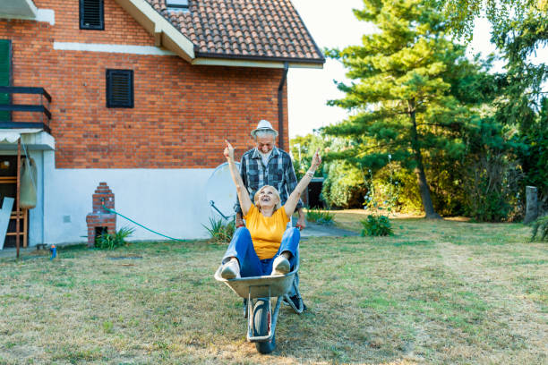 istock Happy senior couple playing with a wheelbarrow 1174518993
