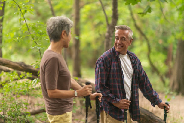 istock Retired couple hiking in forest 1174519634
