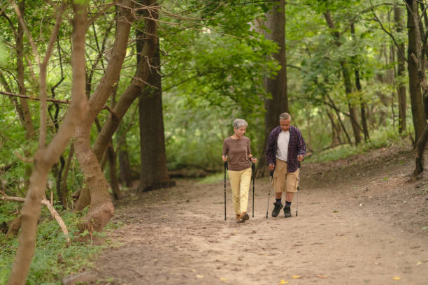 istock Happy senior couple hiking 1174520183