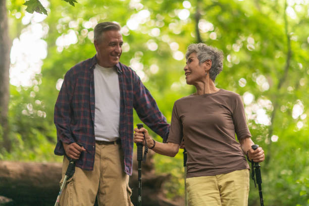 istock Happy senior couple hiking 1174520240