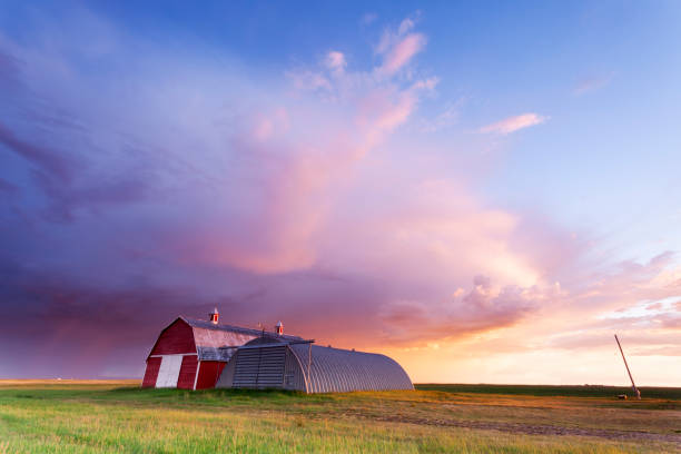 Saskatchewan Red Barn Storm Chasing South Saskatchewan, Tail end of a summer storm, Image taken from a tripod. alberta photos stock pictures, royalty-free photos & images