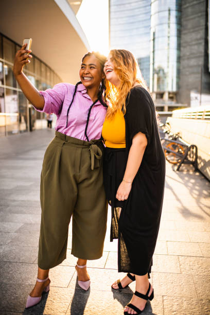 istock Two friends malking a selfie portrait. 1174527603